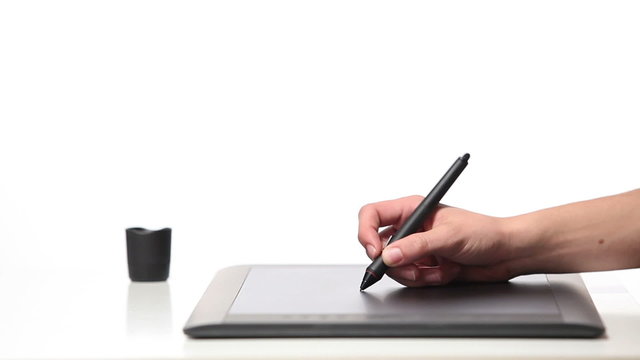 Person drawing on a computer tablet