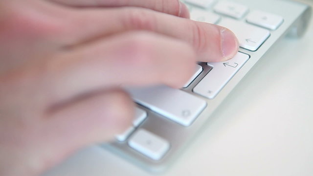 People typing on the keyboard and press enter