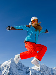 Winter fun - portrait of happy snowboarder girl