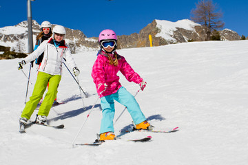 Skiing, winter, ski lesson - skiers on mountainside