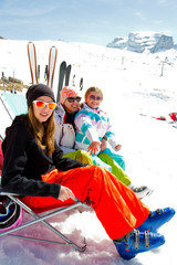Ski, snow, sun and winter fun - skiers in Dolomites