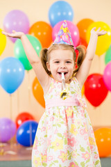 pretty joyful kid girl on birthday party
