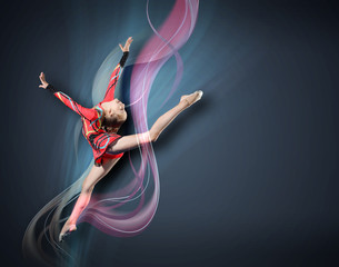 Obraz premium Young woman in gymnast suit posing