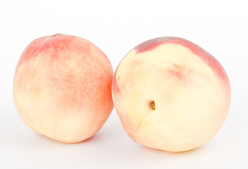 fresh peach fruits on white