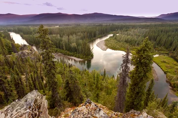 Rucksack Yukon Canada taiga wilderness and McQuesten River © PiLensPhoto