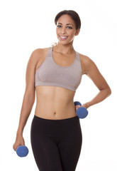 Fototapeta na wymiar Active woman poses in workout clothes with hand weights.