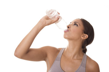 Athlete quenches her thirst with water.