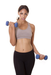 Attractive woman concentrates on her workout.