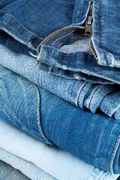 Stack of jeans in different colors