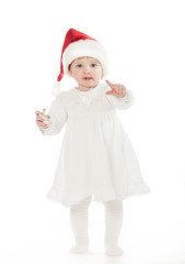 Cute baby girl in Santa's hat