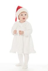 Fototapeta na wymiar Cute baby girl w kapelusz Świętego Mikołaja
