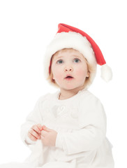 Cute baby girl in Santa's hat