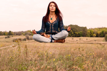 Beautiful girl meditating in yoga pose