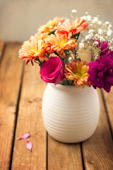 Beautiful flower bouquet on wooden tabletop