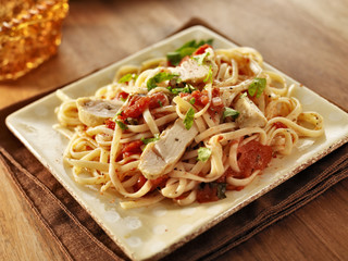 tomato herb linguine with grilled chicken slices