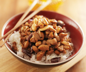 bowl of kung pao chicken with chopsticks
