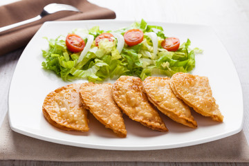 Tuna patties with lettuce salad in a plate