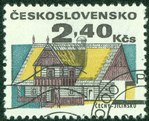 stamp printed in Czechoslovakia shows wooden houses
