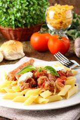 Pasta with tomato, sausage and ricotta