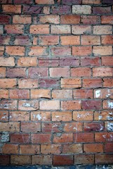 Bricks wall scratched with cement texture