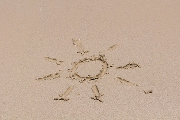 Sun drawing on sand