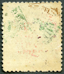 The reverse side of a postage stamp