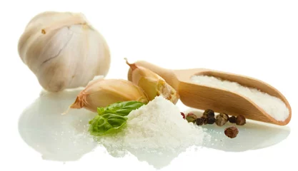 Foto op Plexiglas salt with fresh basil, garlic and pepper isolated on white © Africa Studio
