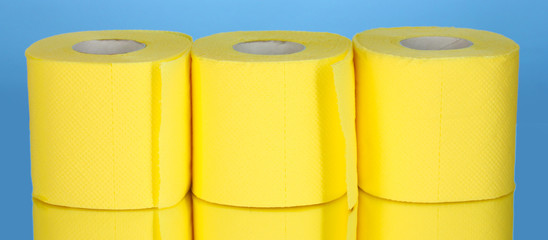 rolls of toilet paper on blue background