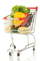 Fresh vegetables in metal trolley isolated on white background