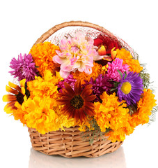 Beautiful bouquet of bright flowers in basket isolated on white