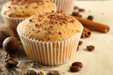 tasty muffin cakes with chocolate, spices and coffee seeds,