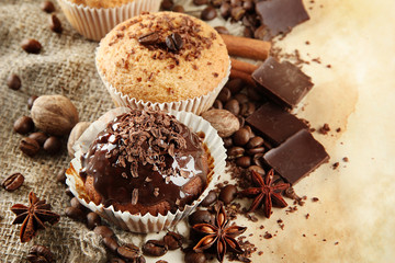 tasty muffin cakes with chocolate, spices and coffee seeds,