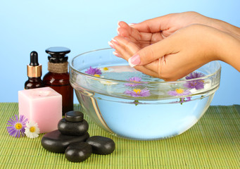 spa treatments for female hands,  on blue background