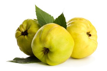 sweet quinces with leaves, isolated on white