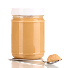 Delicious peanut butter in jar isolated on white