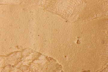 Delicious peanut butter close-up background