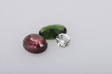 Close up of diamond stone, amethys and emerald