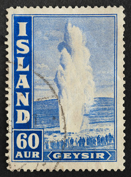 Mail stamp printed in Iceland featuring a geyser, circa 1938