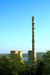 Landscape of construction power factories with big chimneys and