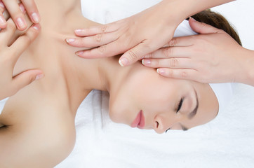 Obraz na płótnie Canvas Facial massage to the woman