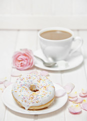 a doughnut and a cup of tea