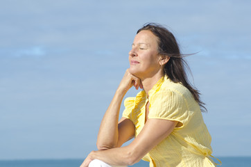 Fototapeta na wymiar Relaxed meditating woman outdoor