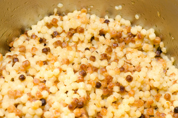 Fregola, tipica pasta sarda, closeup