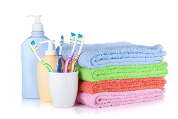 Toothbrushes, shampoo bottles and colored towels