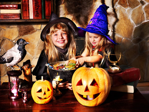Witch  children with pumpkin lantern. .