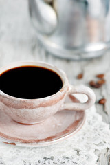 Cup of coffee and coffee beans