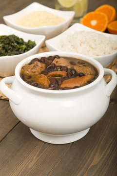 Feijoada - Brazilian meat & bean stew, side dishes & caipirinha