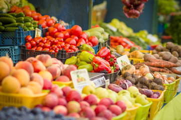 Variety of tomatoes, peppers, peaches, onions, beet roots, carro