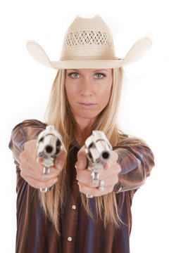 cowgirl points two pistols