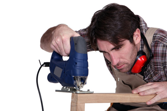 Carpenter using a jigsaw